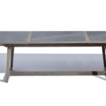 Rectangular dining table with a dark stone top and wooden legs, shown against a white background with a shadow to the left.